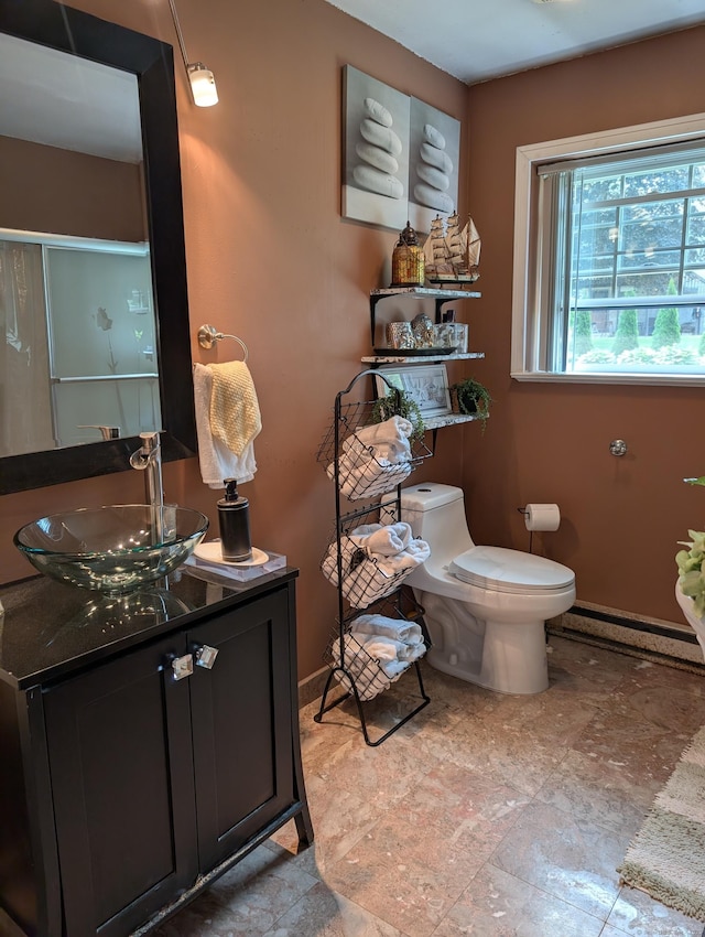 101 Chipper Rd, Waterbury, CT 06704 - full bathroom with toilet, vanity, a shower with door, and baseboards