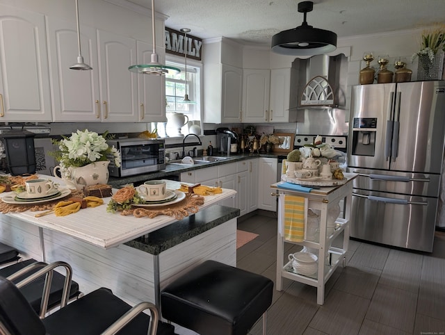 101 Chipper Rd, Waterbury, CT 06704 - kitchen with stainless steel appliances, wall chimney range hood, a sink, white cabinets, and dark countertops