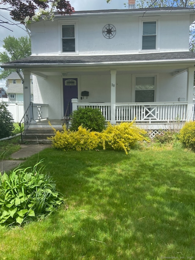 20 Manross Rd, Bristol, CT 06010 - view of front of home featuring covered porch, stucco siding, a front lawn, and a chimney