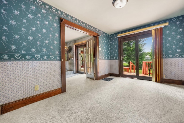 283 Derby Ave, Orange, CT 06477 - carpeted spare room featuring wallpapered walls and french doors