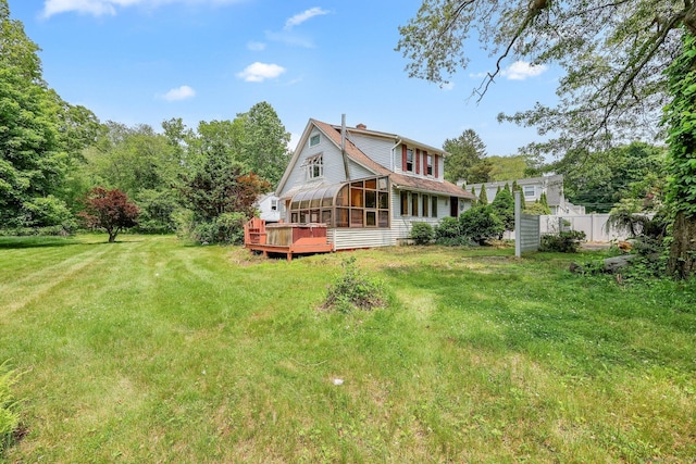 283 Derby Ave, Orange, CT 06477 - back of property with a sunroom, a chimney, and a deck
