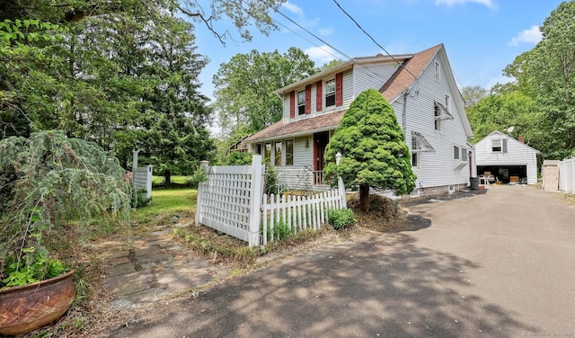 283 Derby Ave, Orange, CT 06477 - view of front of home featuring a garage and an outdoor structure