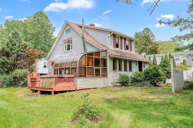 283 Derby Ave, Orange, CT 06477 - back of house featuring a sunroom, a chimney, a wooden deck, and roof with shingles