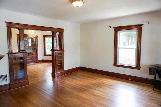 47 Mountford St, Hartford, CT 06114 - unfurnished room featuring a chandelier and wood finished floors
