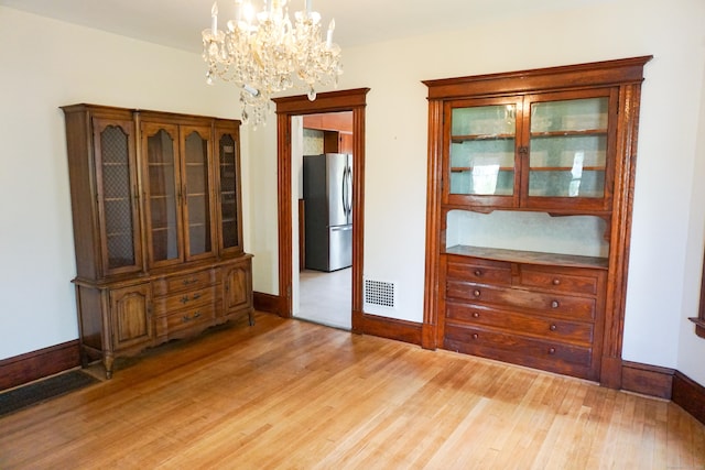 47 Mountford St, Hartford, CT 06114 - dining room featuring light wood-style flooring and a chandelier