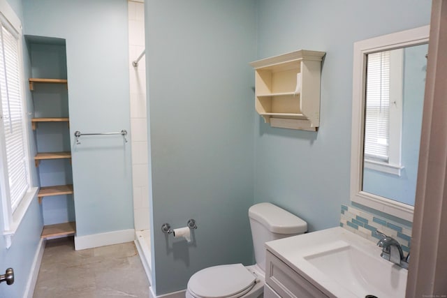 47 Mountford St, Hartford, CT 06114 - bathroom with vanity, a shower, and tasteful backsplash