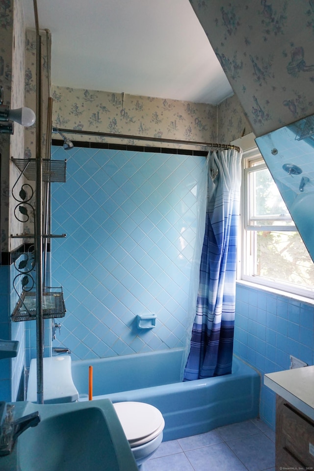 47 Mountford St, Hartford, CT 06114 - full bath with wallpapered walls, tile walls, tile patterned flooring, shower / bath combo with shower curtain, and vanity
