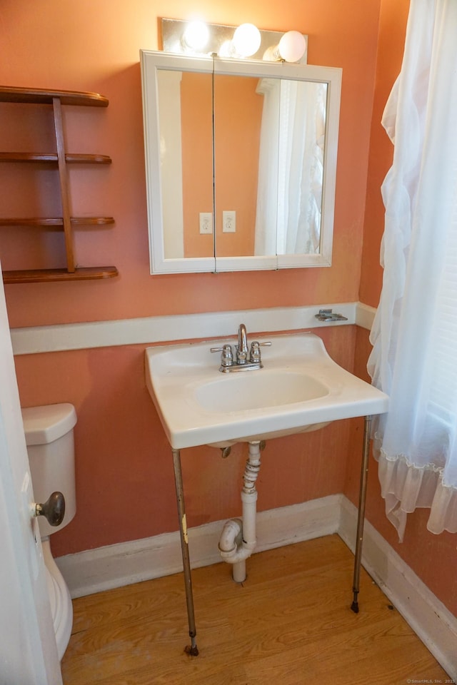 47 Mountford St, Hartford, CT 06114 - bathroom featuring baseboards and wood finished floors