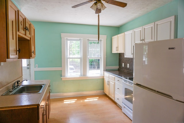 47 Mountford St, Hartford, CT 06114 - kitchen featuring white appliances, ceiling fan, light wood-type flooring, tasteful backsplash, and a textured ceiling