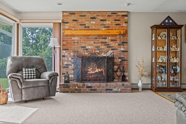 2 Marion Ln, Canterbury, CT 06331 - carpeted living room with healthy amount of natural light, a baseboard heating unit, baseboard heating, and a brick fireplace
