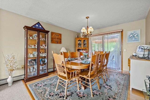 2 Marion Ln, Canterbury, CT 06331 - dining room with a chandelier, wood finished floors, and a baseboard radiator