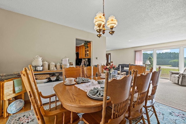 2 Marion Ln, Canterbury, CT 06331 - dining space featuring a chandelier and a textured ceiling