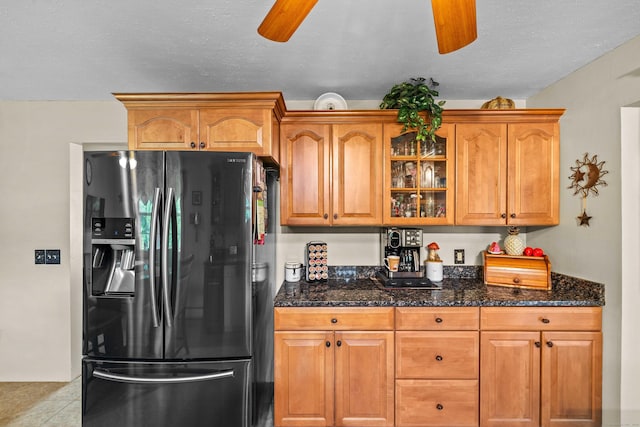 2 Marion Ln, Canterbury, CT 06331 - kitchen with fridge with ice dispenser, ceiling fan, glass insert cabinets, and dark stone counters