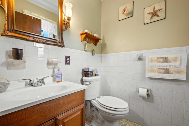 2 Marion Ln, Canterbury, CT 06331 - half bathroom with toilet, tile walls, vanity, and wainscoting