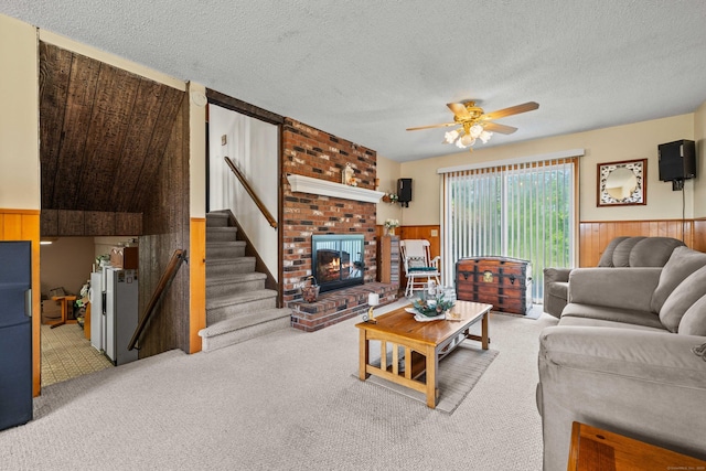 2 Marion Ln, Canterbury, CT 06331 - living area featuring wainscoting, ceiling fan, carpet, wooden walls, and a textured ceiling