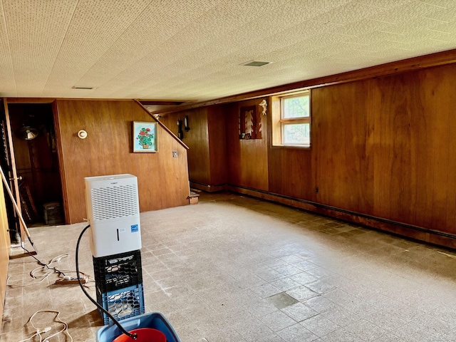 56 Clapboard Ridge Rd, Danbury, CT 06811 - below grade area with wooden walls and tile patterned floors