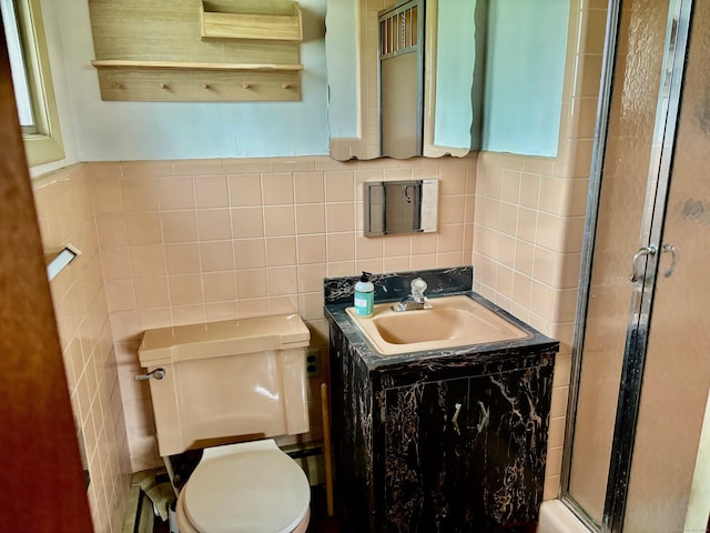 56 Clapboard Ridge Rd, Danbury, CT 06811 - bathroom featuring a stall shower, toilet, tile walls, vanity, and backsplash