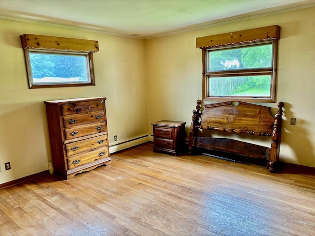 56 Clapboard Ridge Rd, Danbury, CT 06811 - sitting room featuring a baseboard heating unit, light wood-style floors, healthy amount of natural light, crown molding, and baseboards