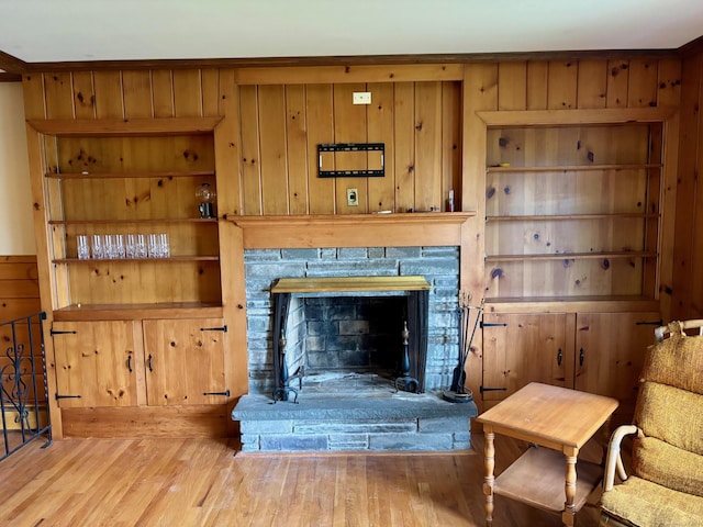 56 Clapboard Ridge Rd, Danbury, CT 06811 - detailed view of wooden walls, a stone fireplace, and wood finished floors