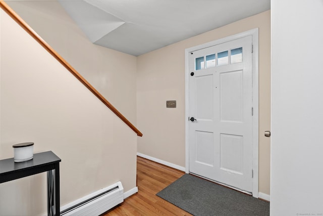 183 Brentmoor Rd, East Hartford, CT 06118 - foyer featuring baseboard heating, light wood-style floors, and stairs