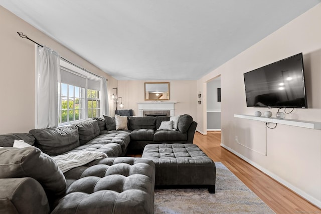 183 Brentmoor Rd, East Hartford, CT 06118 - living room featuring wood finished floors and a fireplace