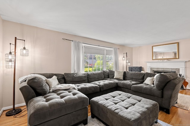 183 Brentmoor Rd, East Hartford, CT 06118 - living area featuring light wood-style floors and a fireplace