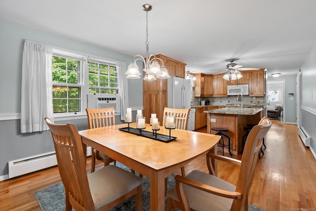 183 Brentmoor Rd, East Hartford, CT 06118 - dining space with baseboard heating, light wood-style floors, ceiling fan, and cooling unit