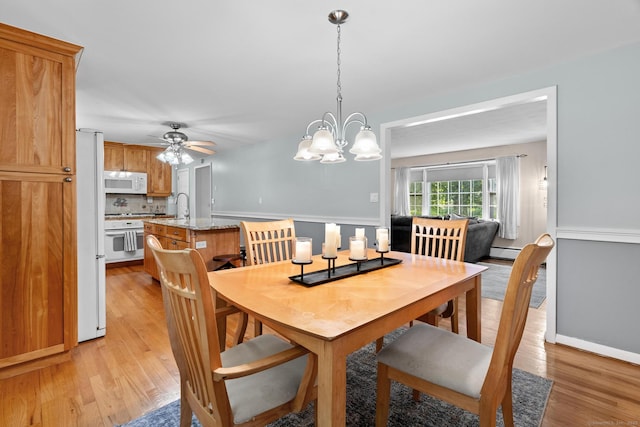 183 Brentmoor Rd, East Hartford, CT 06118 - dining area with light wood finished floors, ceiling fan, and a chandelier