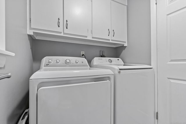 183 Brentmoor Rd, East Hartford, CT 06118 - laundry area featuring cabinet space and separate washer and dryer