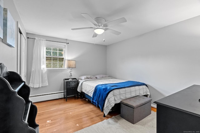 183 Brentmoor Rd, East Hartford, CT 06118 - bedroom featuring baseboard heating, wood finished floors, and a ceiling fan