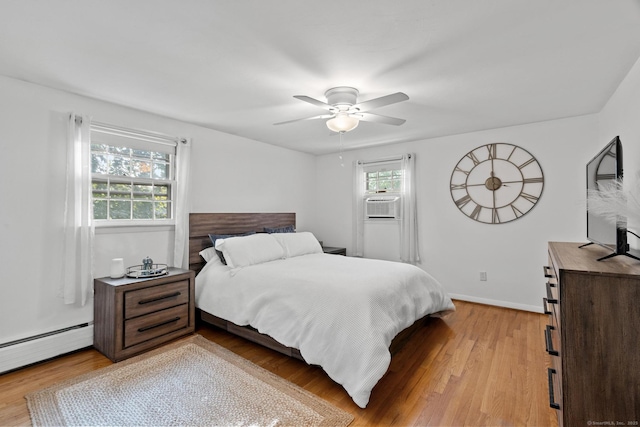 183 Brentmoor Rd, East Hartford, CT 06118 - bedroom with baseboard heating, light wood-type flooring, ceiling fan, and cooling unit