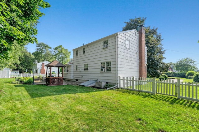 183 Brentmoor Rd, East Hartford, CT 06118 - rear view of house featuring a chimney and a gazebo