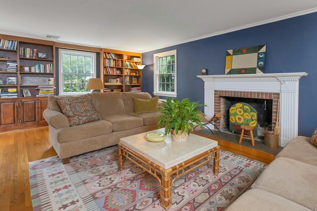 19 Orchard Ln, New Canaan, CT 06840 - living area with wood finished floors, ornamental molding, and a brick fireplace
