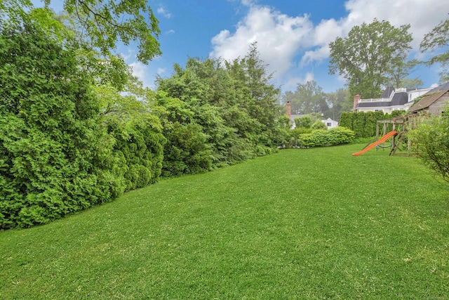 19 Orchard Ln, New Canaan, CT 06840 - view of grassy yard featuring a playground