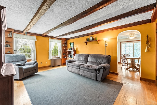 72 Westminster St, Hamden, CT 06518 - living room with radiator heating unit, baseboards, a textured ceiling, hardwood / wood-style flooring, and ceiling fan