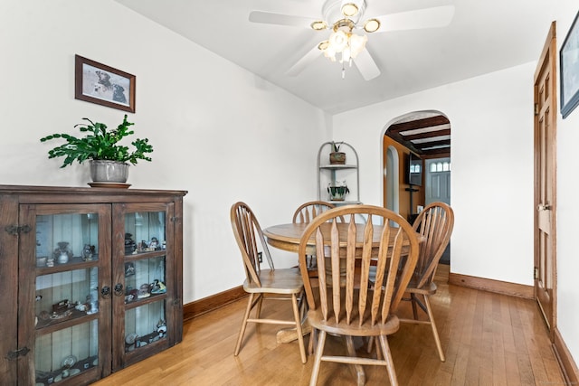 72 Westminster St, Hamden, CT 06518 - dining room featuring arched walkways, light wood finished floors, baseboards, and a ceiling fan