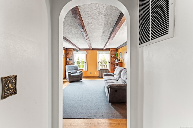 72 Westminster St, Hamden, CT 06518 - hallway with beamed ceiling, arched walkways, wood finished floors, and a textured ceiling