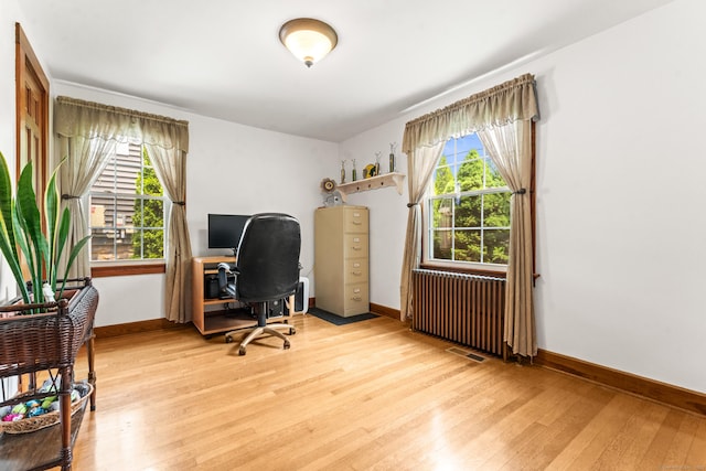 72 Westminster St, Hamden, CT 06518 - home office with radiator, light wood-style floors, and baseboards