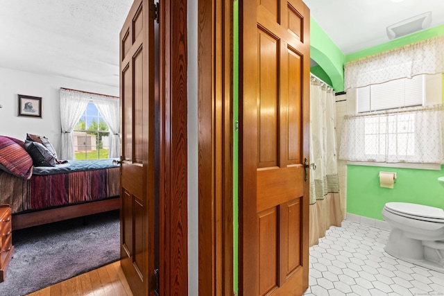 72 Westminster St, Hamden, CT 06518 - bathroom with ensuite bath, toilet, a shower with curtain, and baseboards