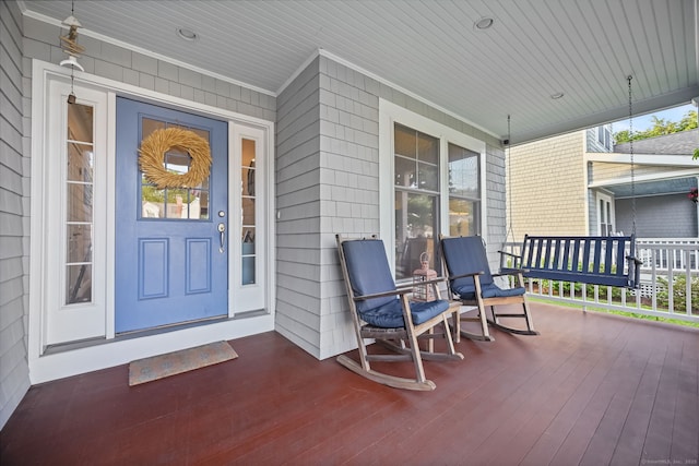 doorway to property with a porch