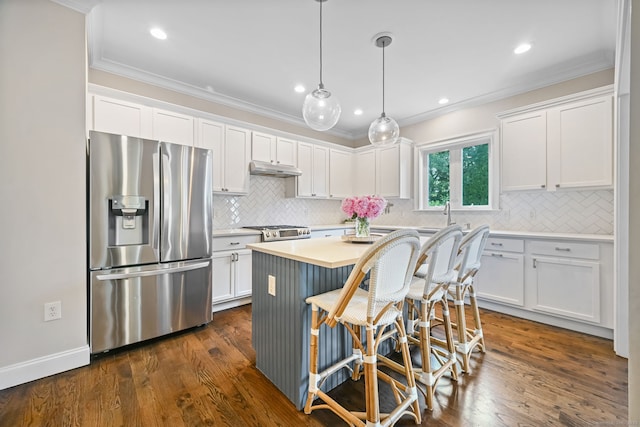 kitchen featuring stainless steel fridge with ice dispenser, crown molding, white cabinetry, light countertops, and recessed lighting