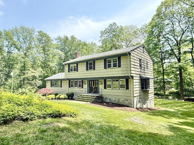 51 Boulder Brook Dr, Stamford, CT 06903 - colonial home featuring a chimney and a front yard