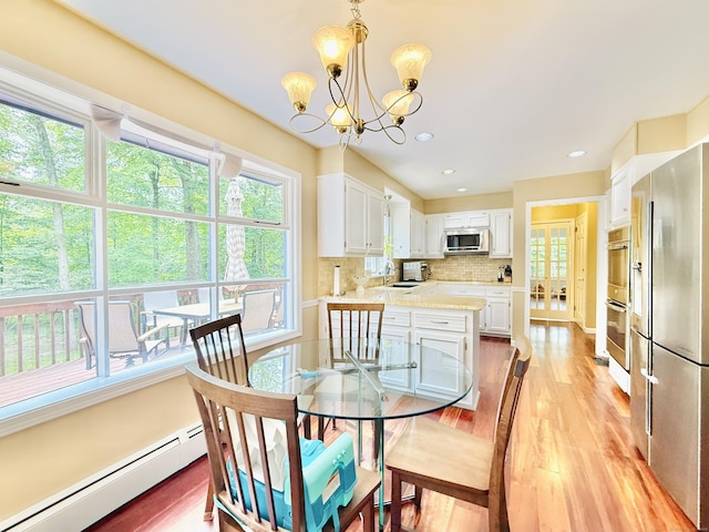 51 Boulder Brook Dr, Stamford, CT 06903 - dining area with a baseboard radiator, a chandelier, light wood-style floors, and recessed lighting