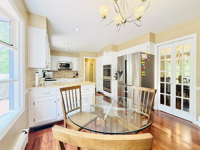 51 Boulder Brook Dr, Stamford, CT 06903 - dining space with a chandelier, wood finished floors, and recessed lighting