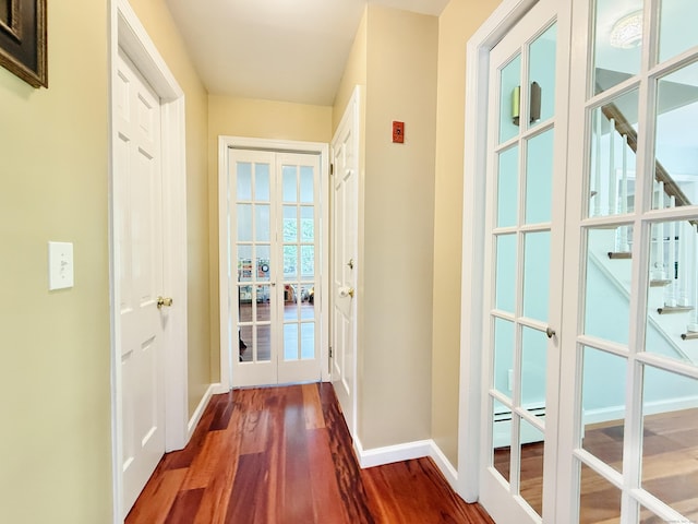 51 Boulder Brook Dr, Stamford, CT 06903 - doorway to outside with french doors, baseboards, dark wood finished floors, and baseboard heating