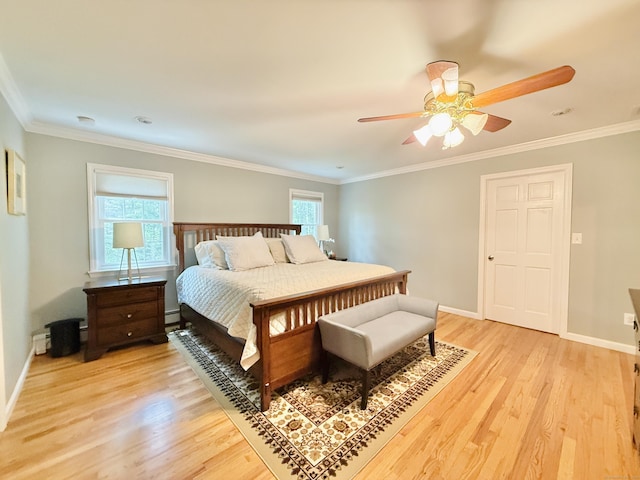 51 Boulder Brook Dr, Stamford, CT 06903 - bedroom with light wood finished floors, crown molding, baseboards, ceiling fan, and a baseboard radiator
