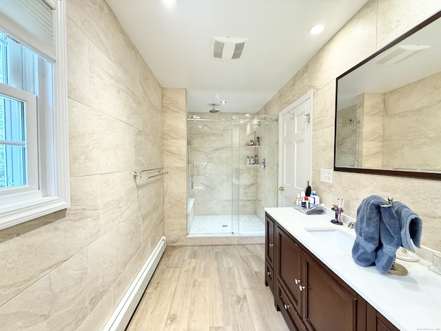 51 Boulder Brook Dr, Stamford, CT 06903 - bathroom featuring a stall shower, vanity, wood finished floors, and tile walls