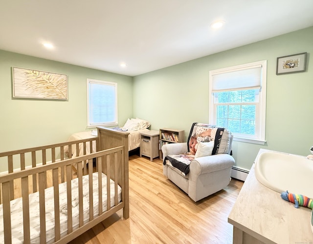 51 Boulder Brook Dr, Stamford, CT 06903 - bedroom with light wood-style floors, multiple windows, recessed lighting, and baseboard heating