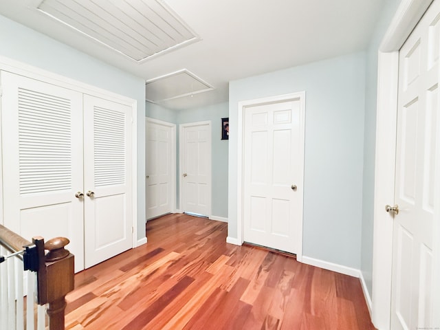 51 Boulder Brook Dr, Stamford, CT 06903 - unfurnished bedroom featuring attic access, light wood-style floors, baseboards, and a closet