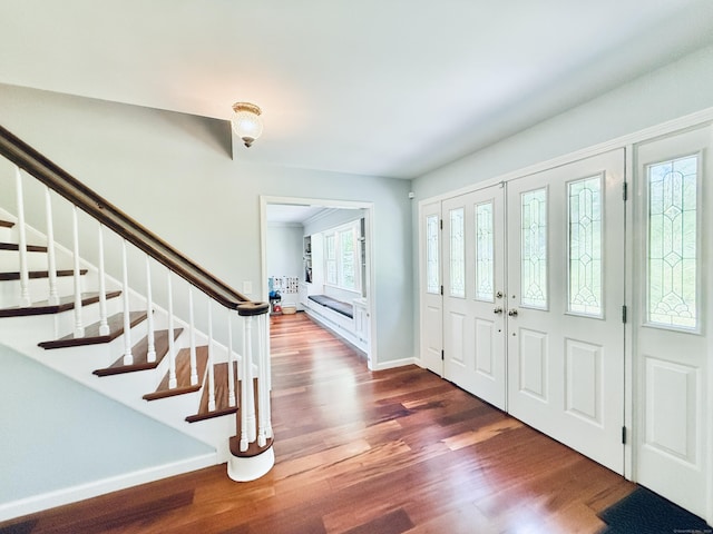 51 Boulder Brook Dr, Stamford, CT 06903 - foyer entrance with wood finished floors, stairs, and baseboards